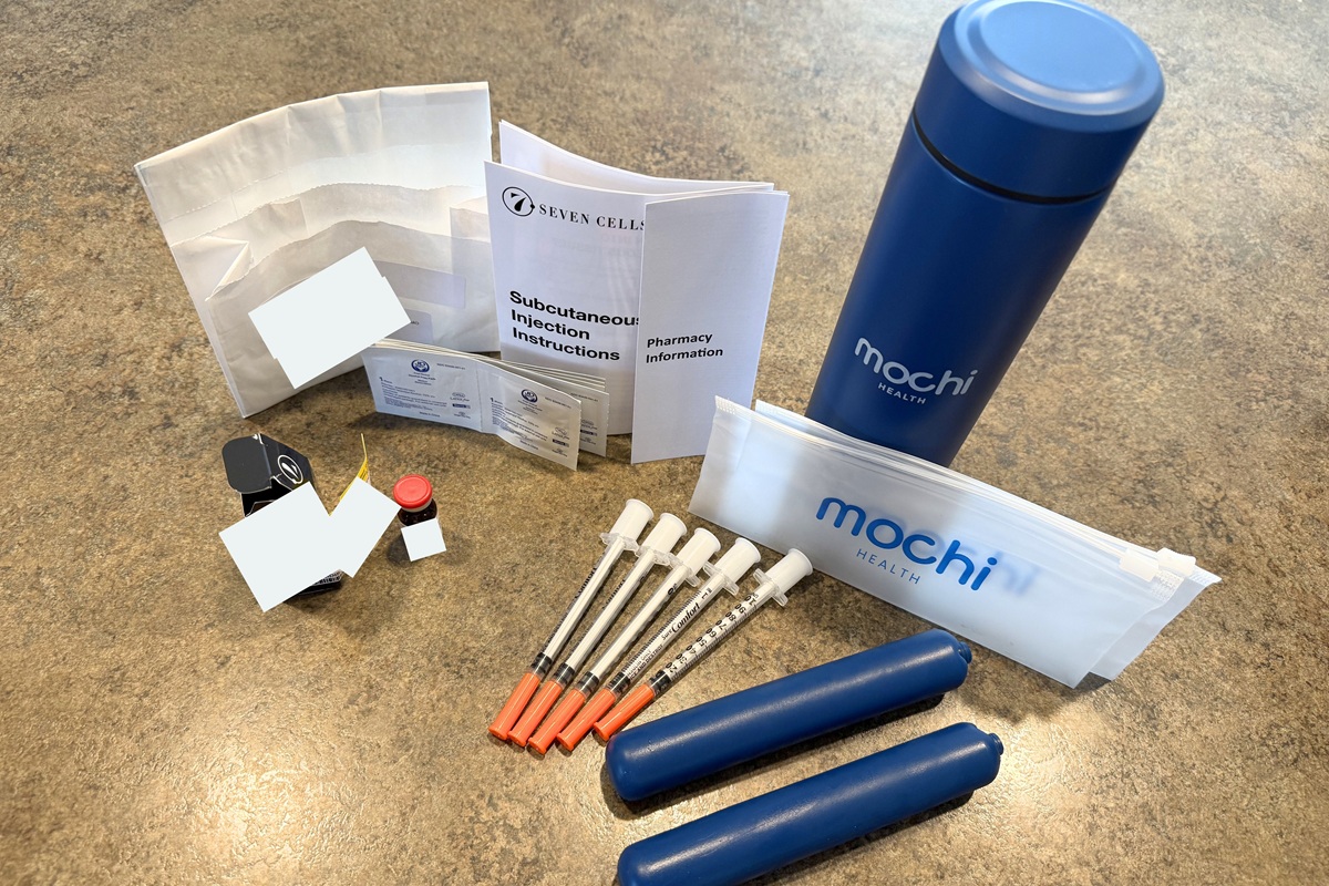 Mochi Health Medication vial, water bottle, two ice packs, instruction sheets, alcohol wipes, and extra sharps