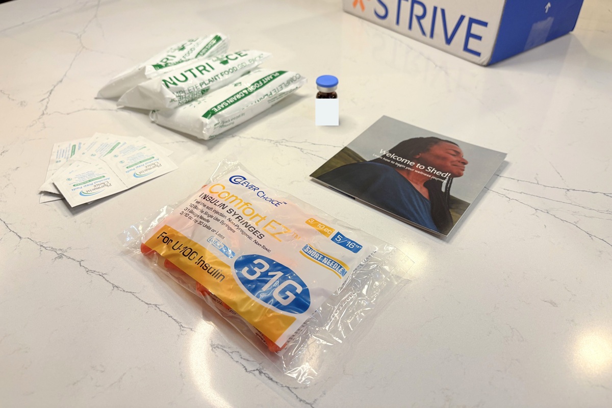 ShedRx medication vial, instructions leaflet, alcohol wipes and a pack of extra sharps